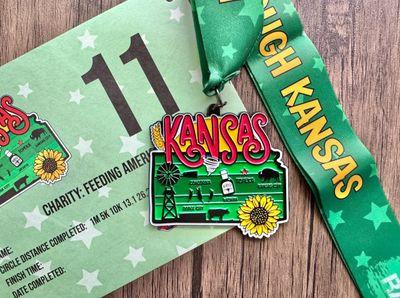 Virtualrunevent Race Through America 50 State Challenge medal with all 50 state medals and bibs displayed.