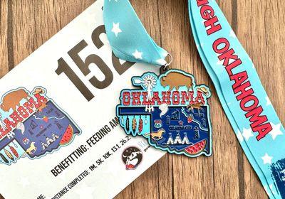 Virtualrunevent Race Through America 50 State Challenge medals and bibs displayed, showcasing all 50 state-themed medals.
