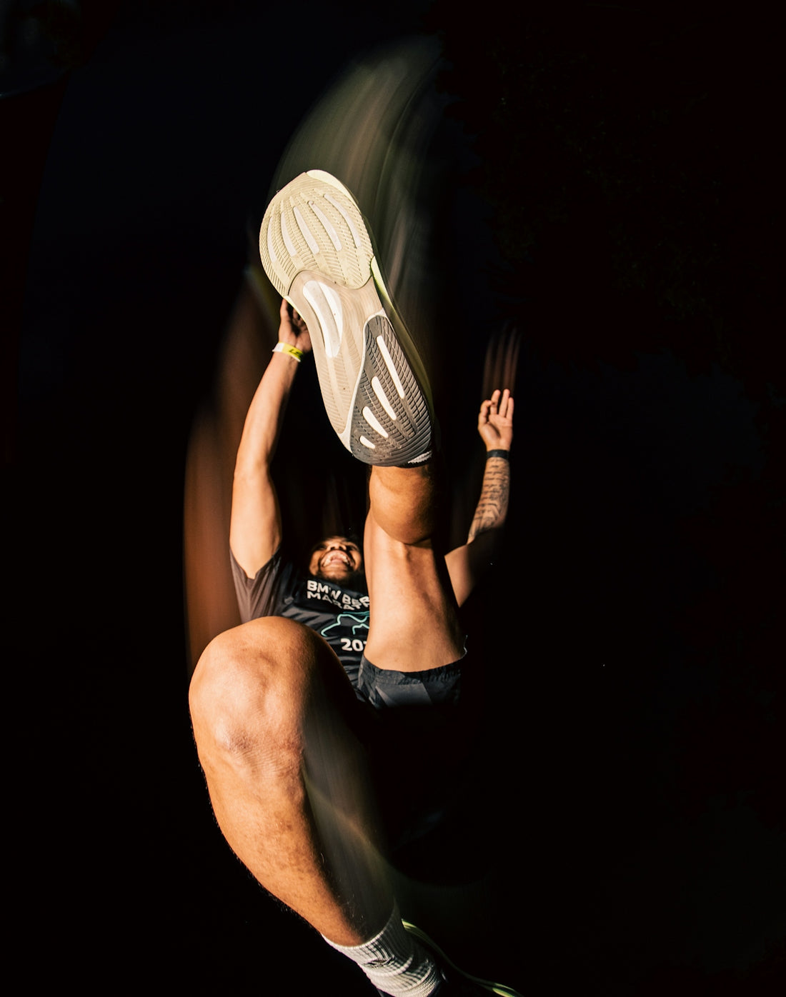 a man is jumping in the air with a tennis racket