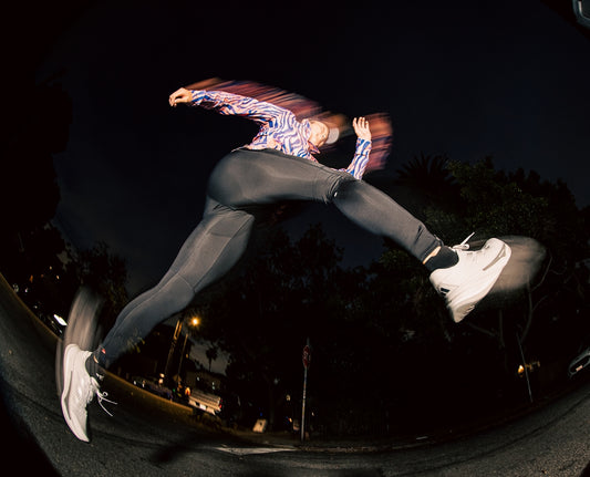 a man riding a skateboard down the side of a ramp