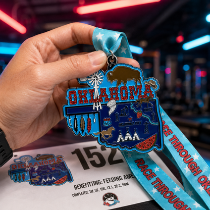 Hand holding the Virtualrunevent Race Through Oklahoma medal for 5K, 10K, Half Marathon, and 50 Mile Challenge.