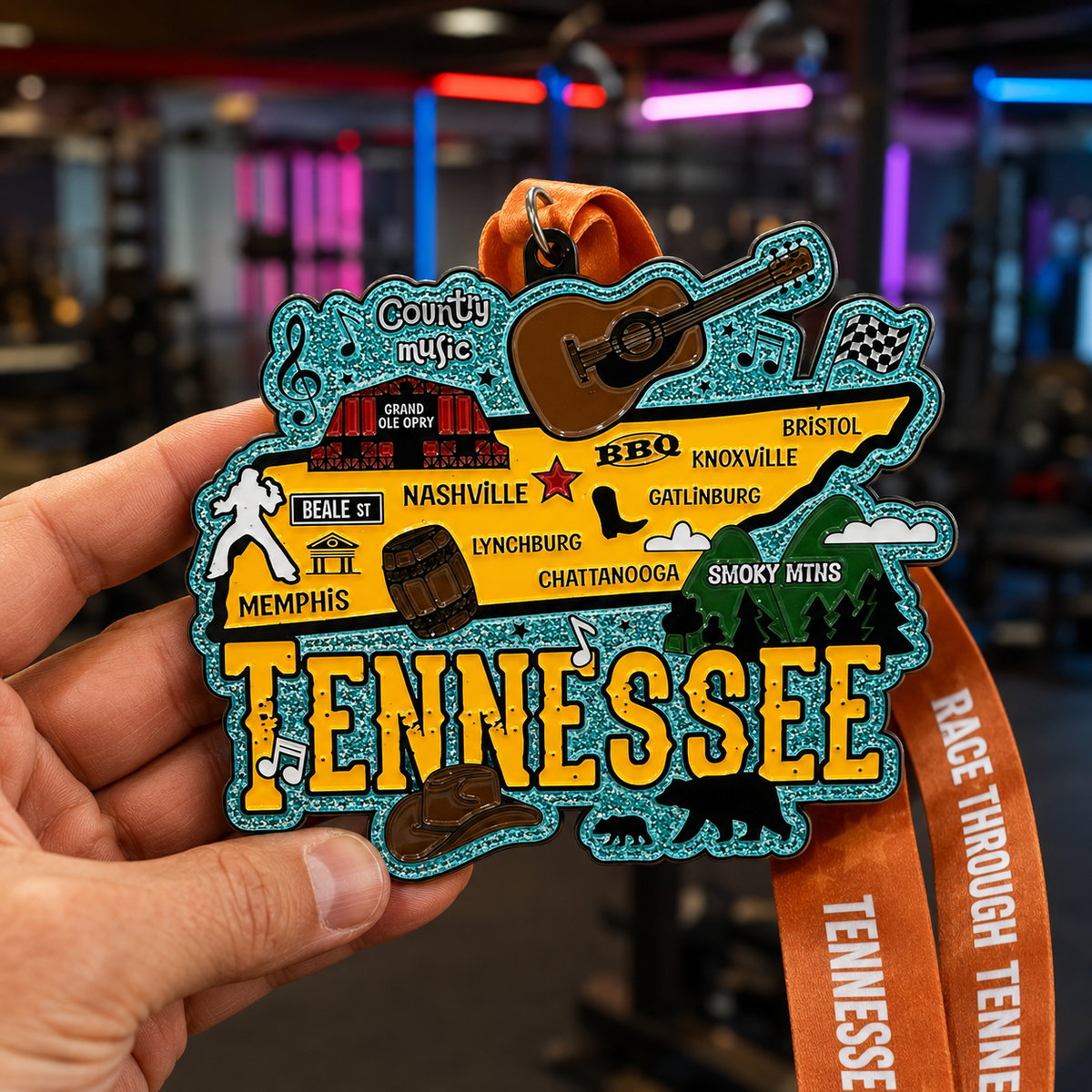 Hand holding a virtualrunevent Race Through America 50 State Challenge medal with colorful design and ribbons.