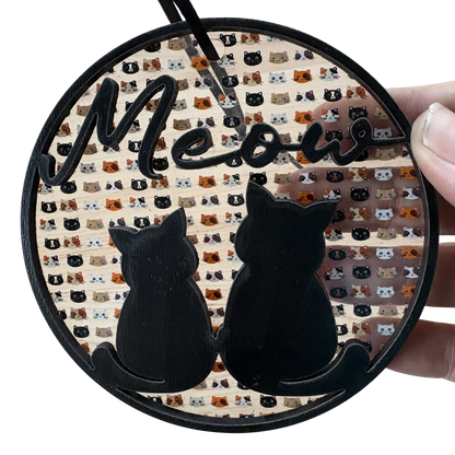 Layered wood and acrylic cat ornament featuring a playful design, perfect for cat lovers and holiday decor.