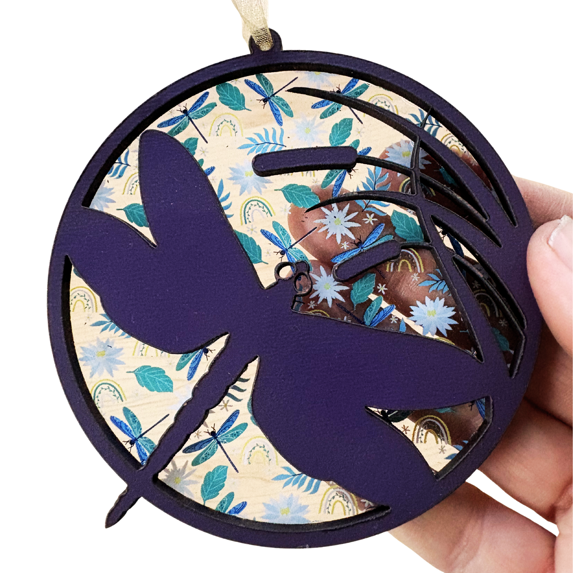 Purple dragonfly ornament made of layered wood and acrylic, measuring 3.75 inches, showcasing intricate detailing.