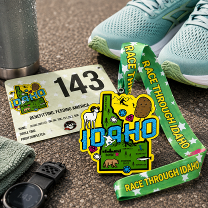 Silver medal for the Race Through Idaho Virtual Race, featuring running shoes and Idaho-themed design by virtualrunevent.