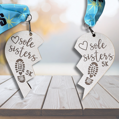 Virtualrunevent Sole Sisters 5K virtual race medal with engraved design and colorful ribbon for celebrating the event.