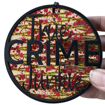 Layered wood and acrylic True Crime Junkie ornament, 3.75 inches, featuring crime scene decor design.