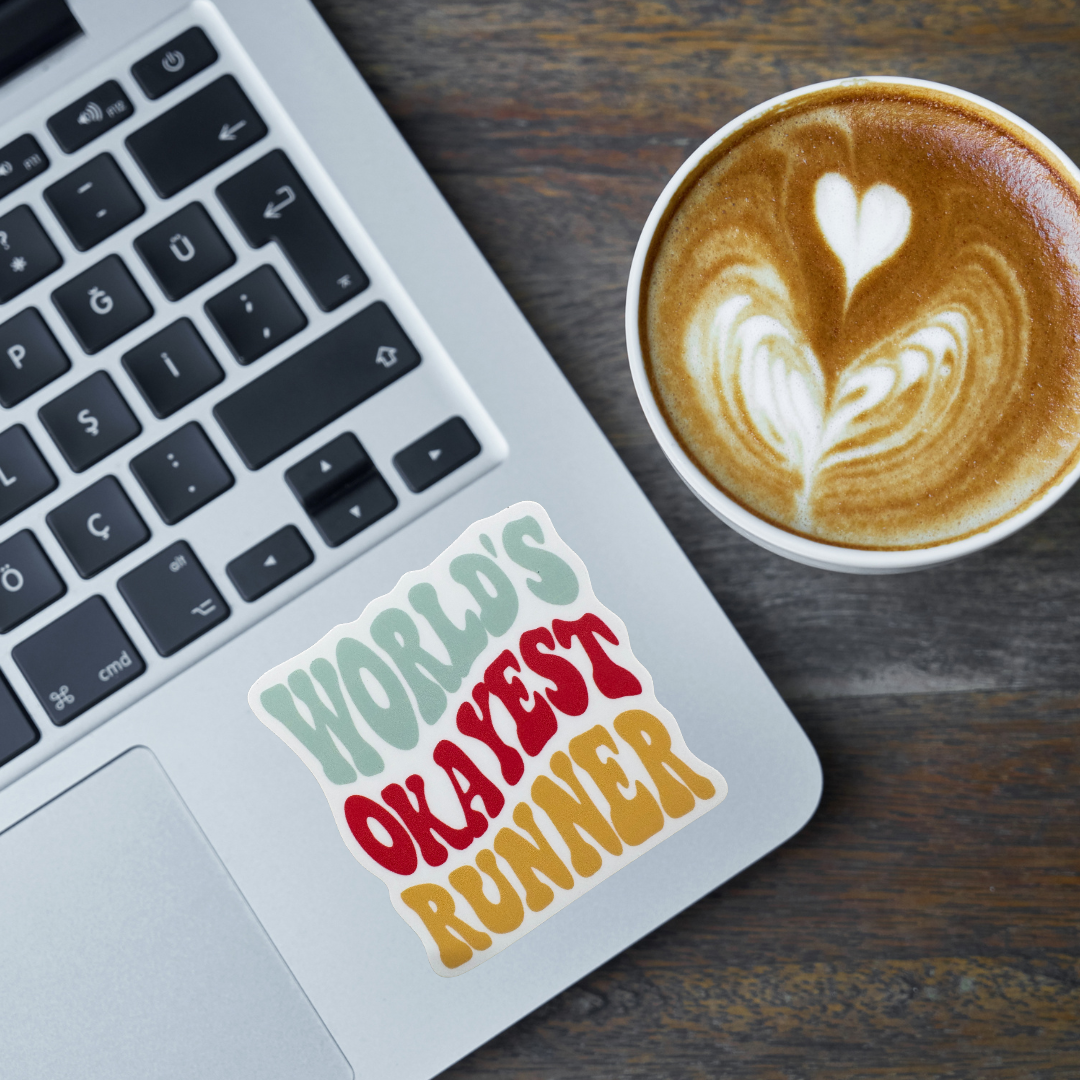 Virtualrunevent world's okayest runner sticker featuring humorous text on a colorful background for runners and sports enthusiasts.