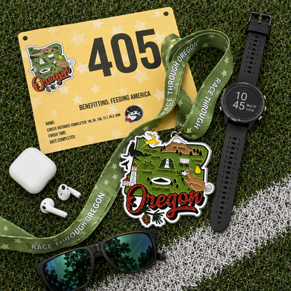 Virtualrunevent Race Through Oregon medal laid flat with race bib, showcasing a commemorative medal for 5K, 10K, half marathon, and marathon.