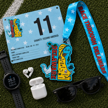 Virtualrunevent Delaware Race medal for 5K, 10K, half marathon, and 50-mile challenge, displayed on a flat surface.