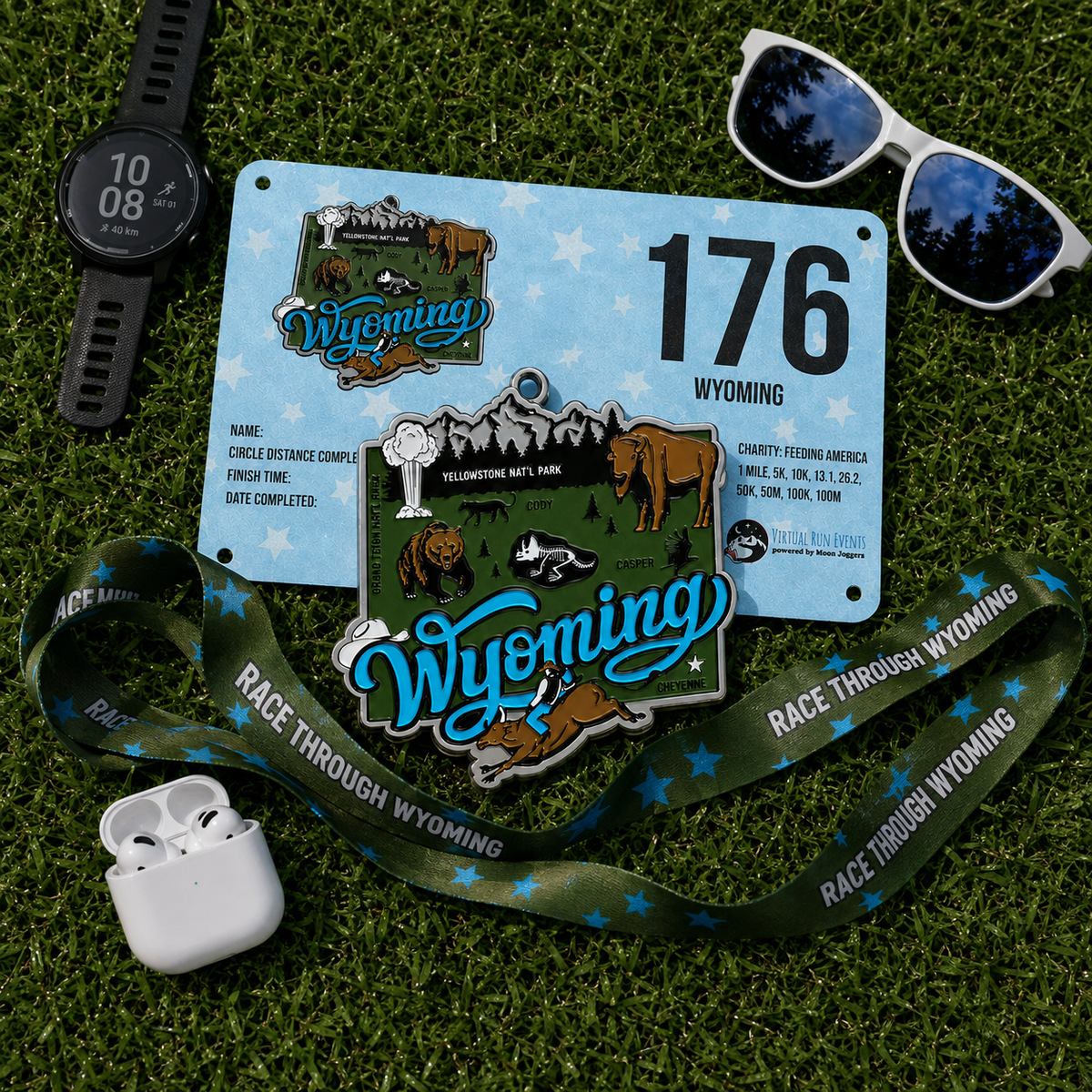 Virtualrunevent Race Through Wyoming medal with colorful design, displayed alongside race bib for 5K, 10K, half marathon, and marathon.