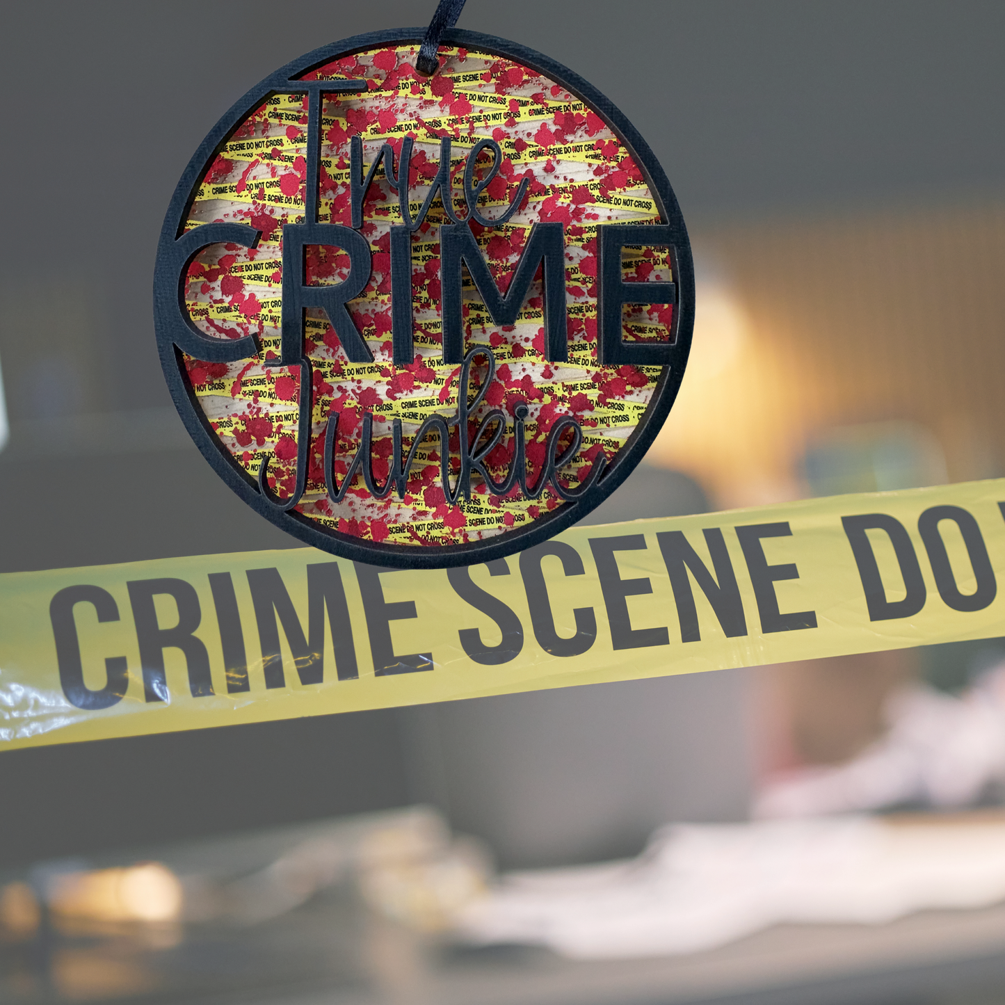 Layered wood and acrylic True Crime Junkie medal ornament with crime scene decor, measuring 3.75 inches.