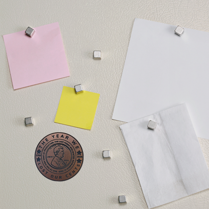 VirtualRuneEvent Lost Our Cents magnet featuring a humorous design with the phrase "Lost Our Cents" on a small decorative magnet.