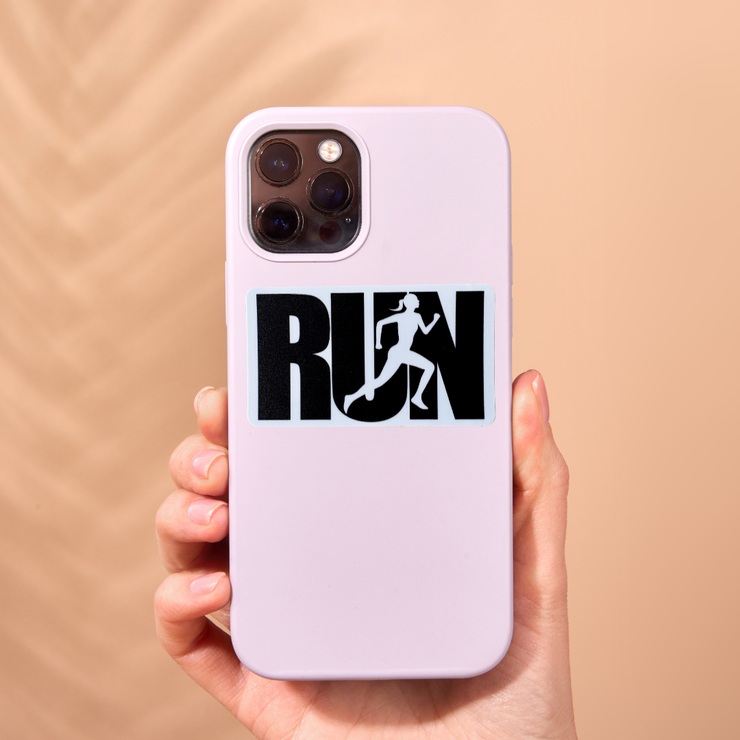 Black and white "RUN" medal sticker by VirtualRunEvent, featuring bold lettering on a sleek, circular design.