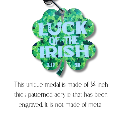 Gold-colored 2026 Luck of the Irish 5K medal by virtualrunevent with shamrock design and engraved event details.