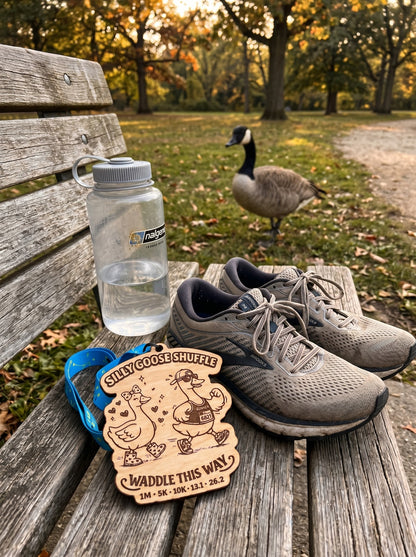 Silver Silly Goose Shuffle Virtual Race medal with engraved goose design from virtualrunevent.