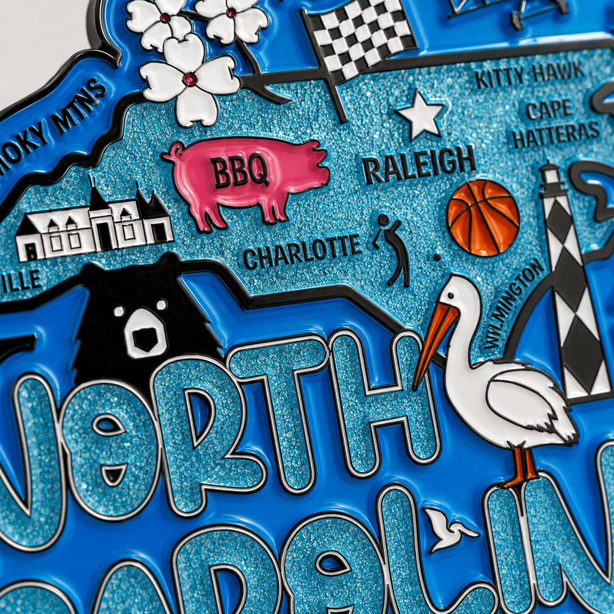 Close-up of Virtualrunevent North Carolina virtual race medal featuring intricate design and engraved race details.