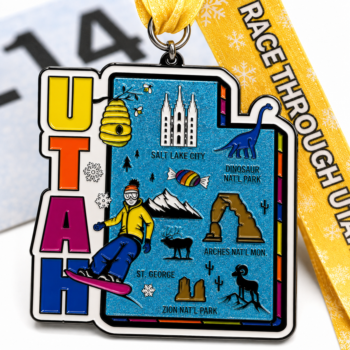 Close-up of a virtualrunevent Race Through Utah medal featuring engraved details and a colorful Utah landscape design.