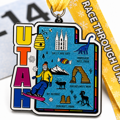 Close-up of a virtualrunevent Race Through Utah medal featuring engraved details and a colorful Utah landscape design.