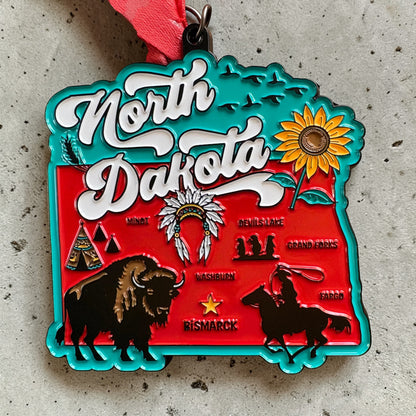 North Dakota race medal and bib for Virtual Run Event, celebrating 1M, 5K, 10K, 13.1, and 26.2 distances.